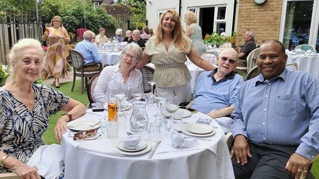 Kingston Vale care home toasts key milestone with garden party