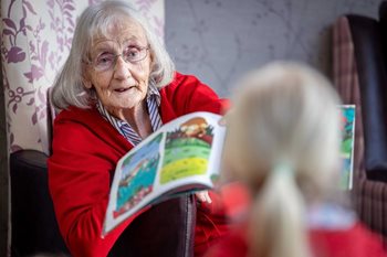 Booksmart! Retired schoolteacher and Cheadle care home resident reads popular stories to local children