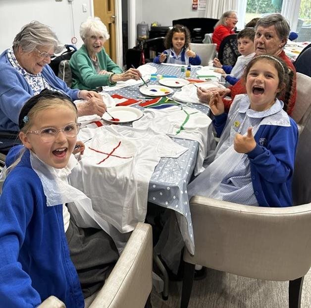 Fleet care home teams up with schoolchildren for matchday magic