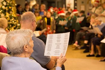 Brownies and Scouts join Ashford care home for journey into Christmas past