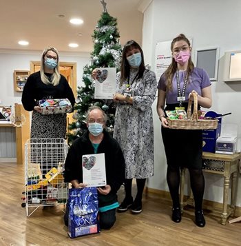 Stroud care home shares festive cheer with paw-some local charity