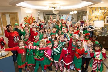 Local care home residents join pupils for Santa’s dancing elves 