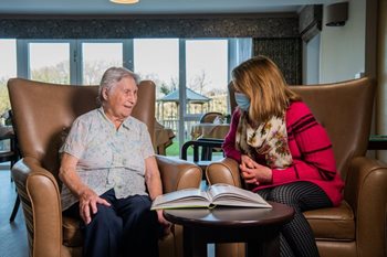 When should someone with dementia go into a care home?