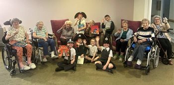 Stansted care home residents read stories to local youngsters
