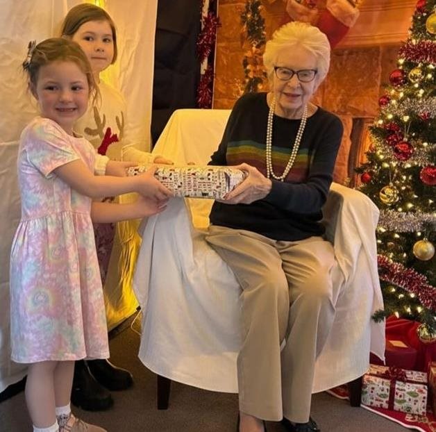 Local primary school children join East Grinstead care home for a journey into Christmases past