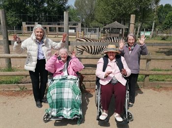 What an ape-solute treat – local care home residents receive the VIP treatment at zoo 