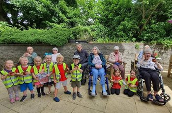 Reunited at last! Care home residents meet up with their young friends after two years apart