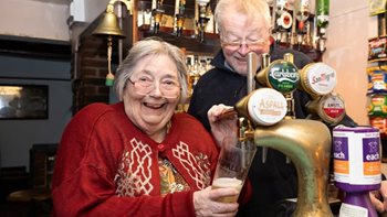 Care home resident gets back behind the bar