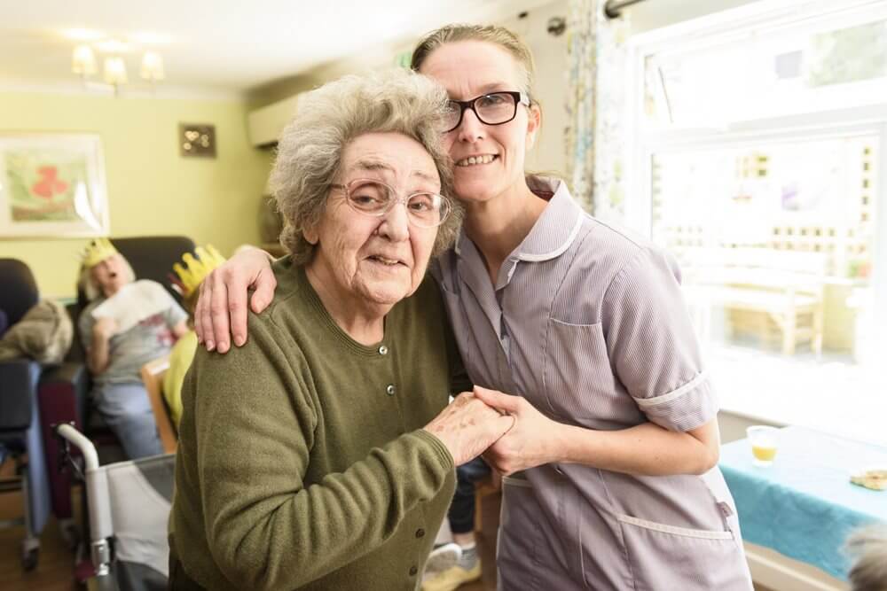 Charlotte House - charlotte-house-team-member-jenny-wood-dancing-with-resident-sheila-allen_1 image