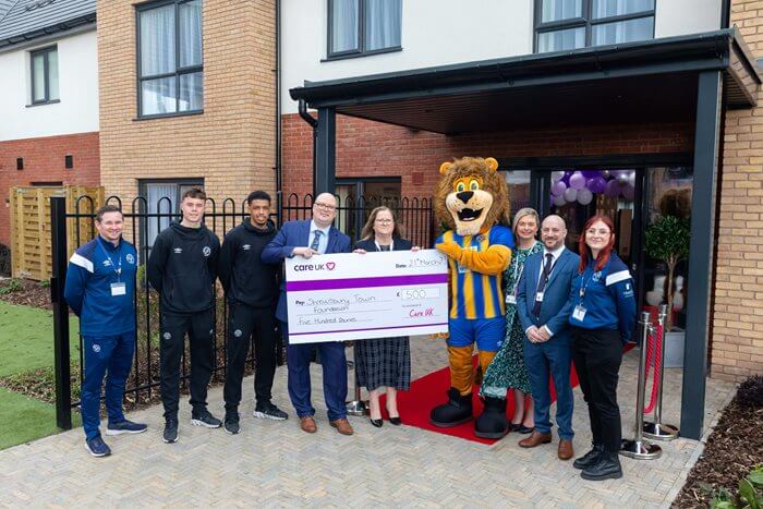 As part of the grand launch for Oxbow Manor care home in Shrewsbury, the team donated £500 to the Shrewsbury Town Foundation