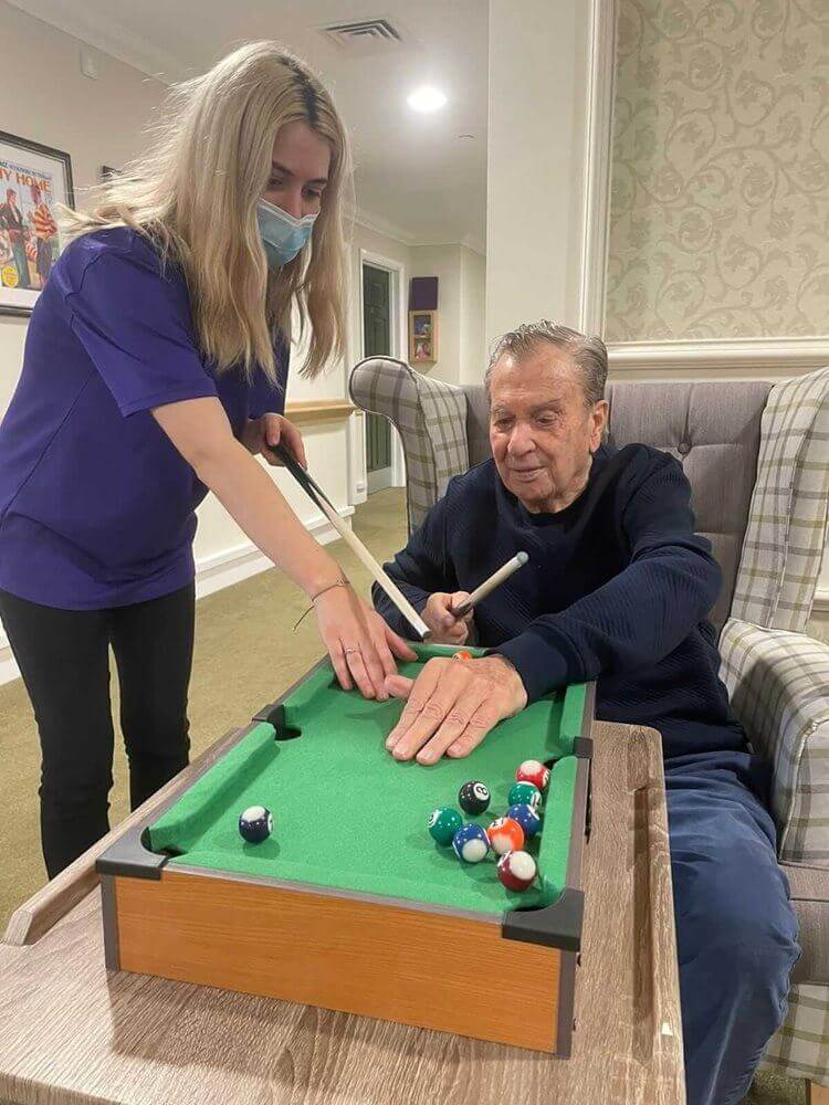 Jimmy at Bickerton House teaches Nyah how to play snooker.