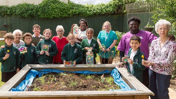 Residents at Ivy Grove were joined by local schoolchildren for a special gardening activity designed to help wildlife thrive.