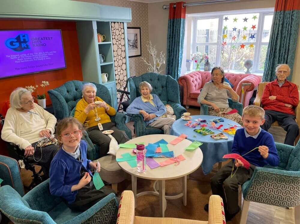 Residents at Highmarket House welcomed children from Hillview Primary School into the home to try hobbies like calligraphy, sewing and knitting.