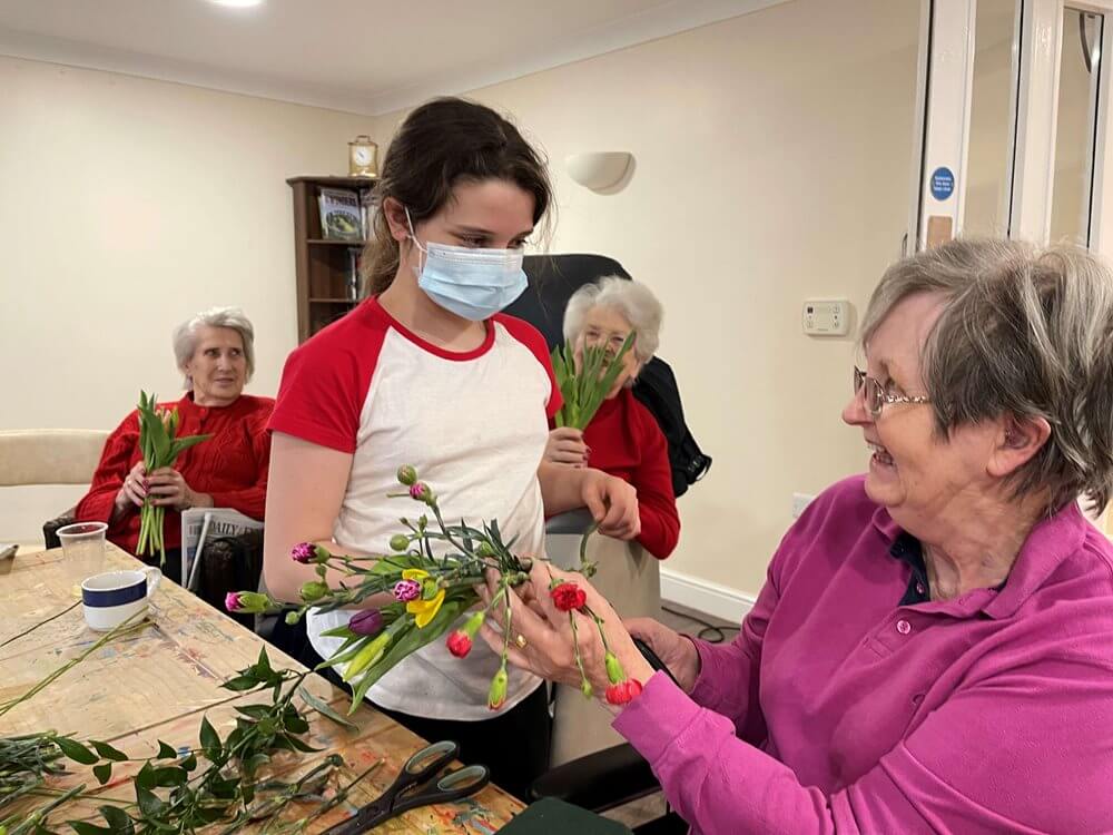 Team members at Kentford Manor planned a flower arranging workshop with resident Caryl, a former florist for the WI.