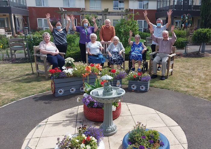 Residents at Glastonbury Court celebrate winning local flower competition Bury in Bloom.