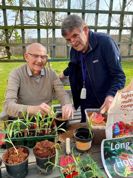 Residents at Perry Manor get stuck in for an afternoon of gardening, from flower arranging to vegetable growing in the home’s garden.