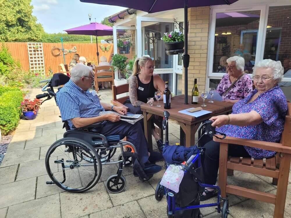 Team Leader Care Bank - Davers Court residents in the garden