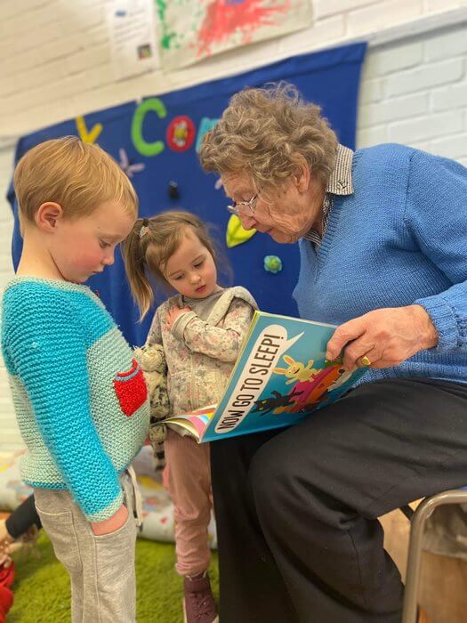 Residents at Sway Place read to children.